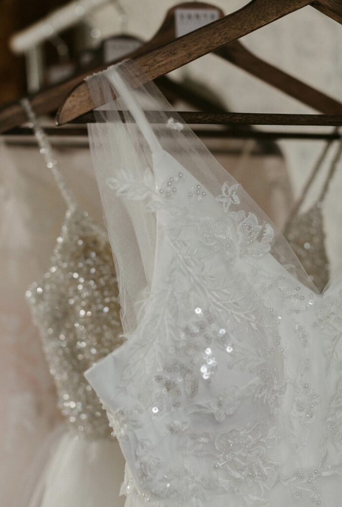 White and ivory wedding dresses on hangers