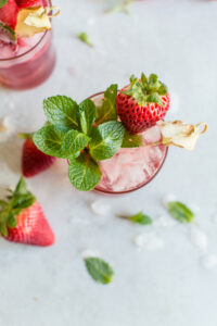 pink fruity cocktail with mint and strawberries