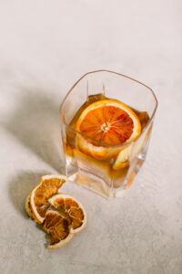 Cocktail with an orange slice in a highball glass