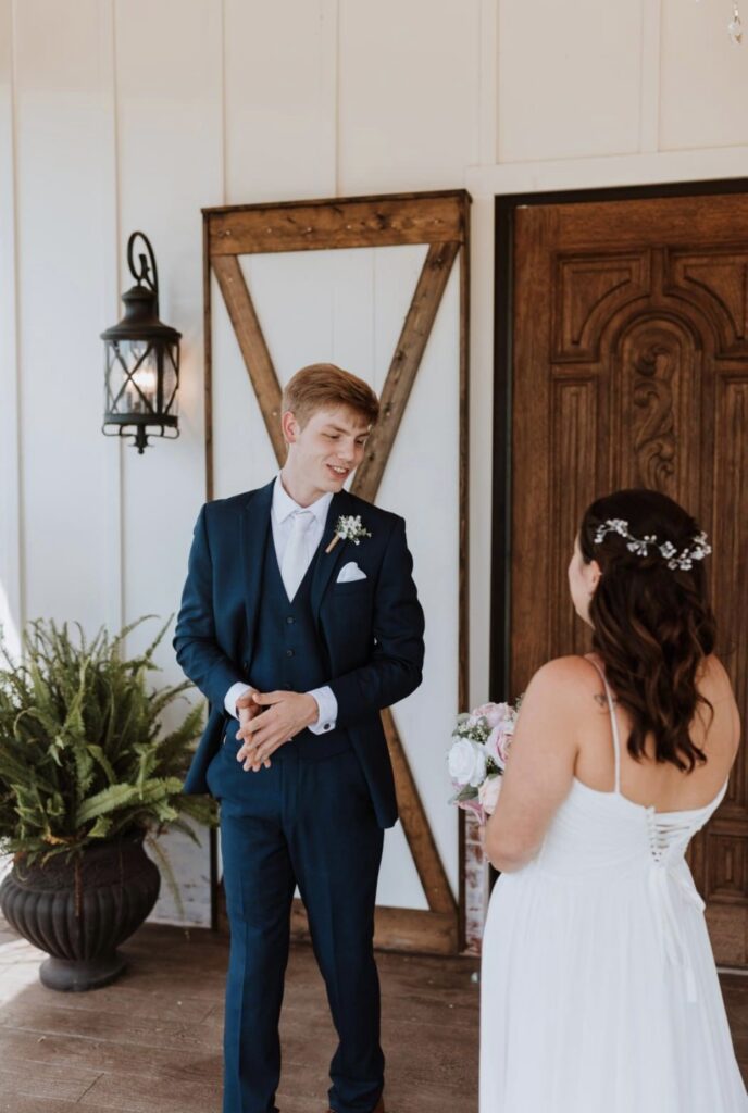 The groom turns around to see the bride for the first time on their wedding day. 