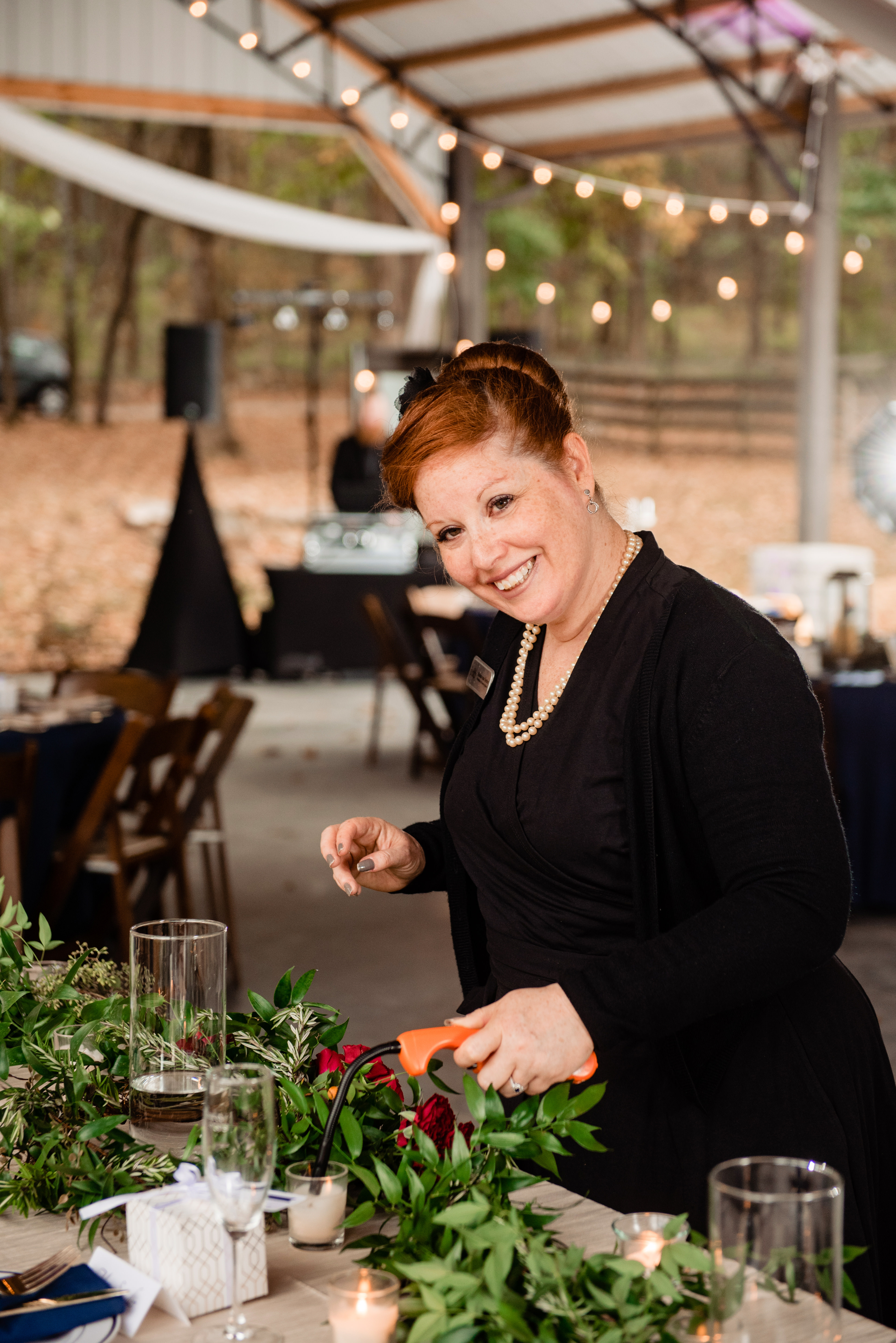 Raina, owner and lead planner of Weddings and Events by Raina at vineyard wedding.