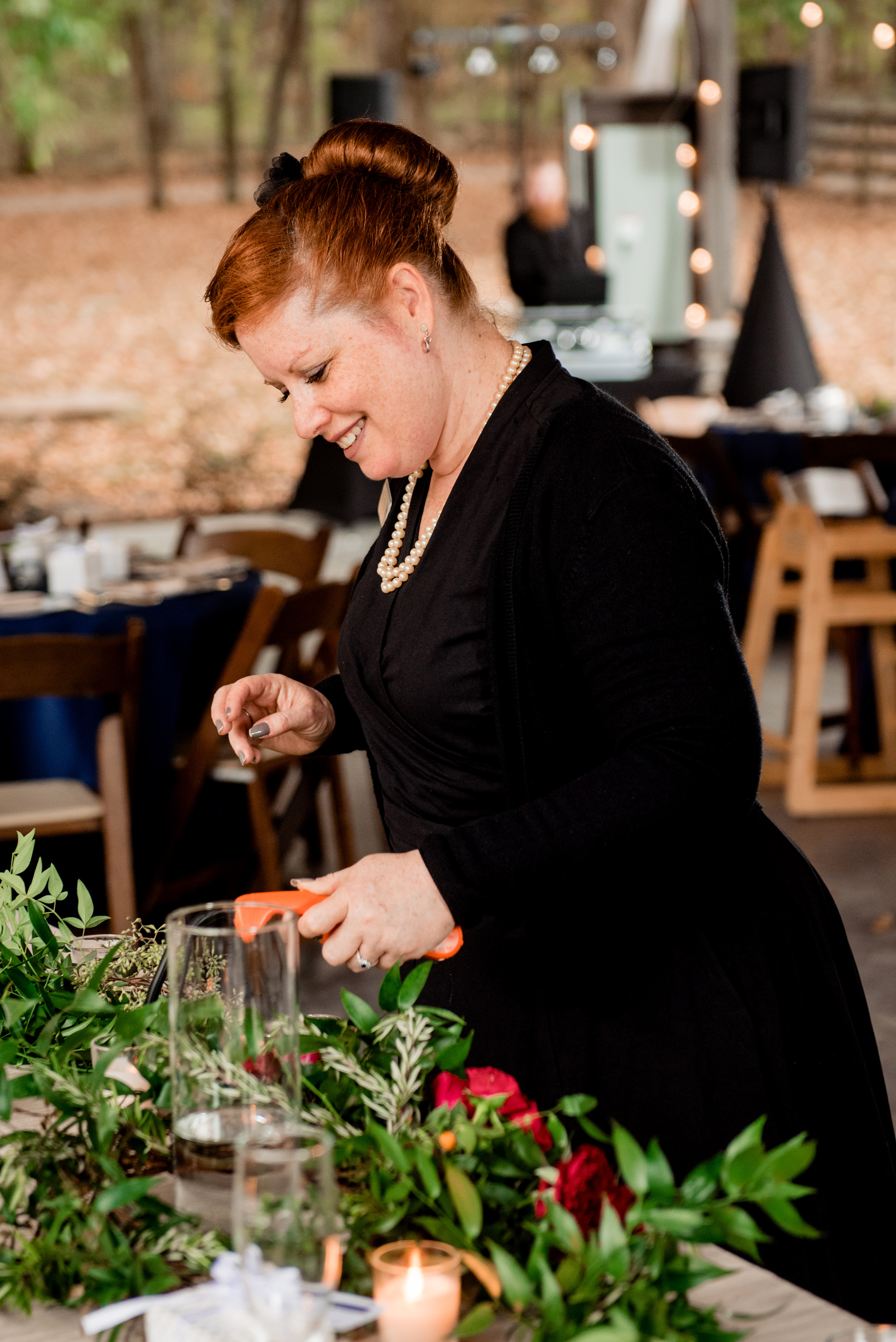 Raina, owner and lead planner of Weddings and Events by Raina at vineyard wedding.