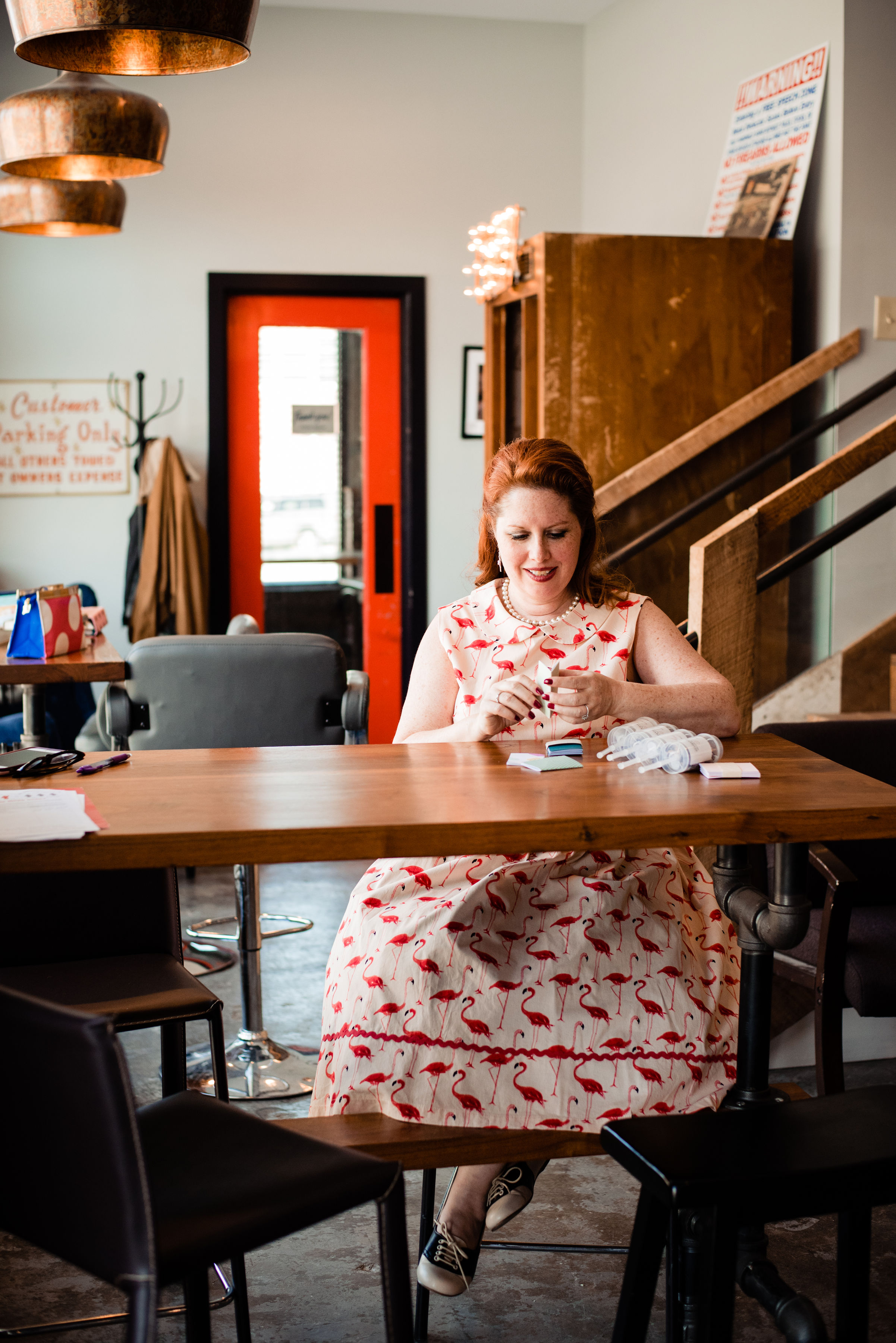 Raina, owner and lead planner of Weddings and Events by Raina packaging wedding favors.