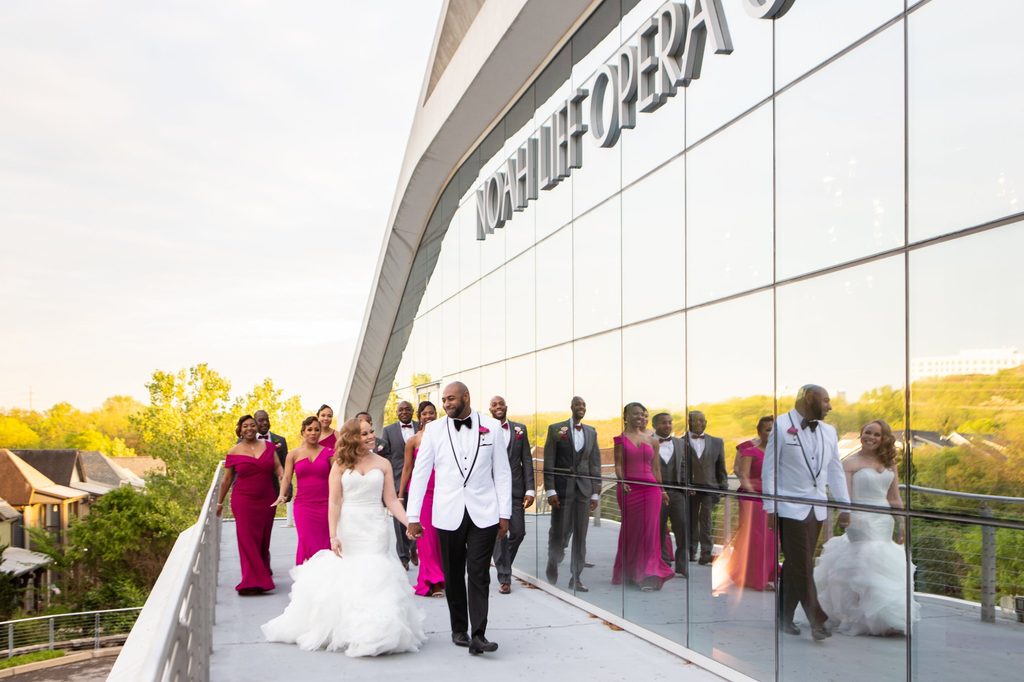 Bridal party on the patio at their wedding reception at Noah Liff Opera Center in Nashville Tennessee