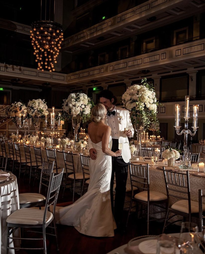 A bride and groom embrace a their wedding reception at the Schermerhorn Symphony Center in Nashville, Tennessee