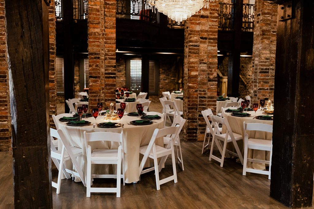 Bespoke autumn wedding at The Bedford Nashville Event Venue with crystal chandeliers, exposed brick and hardwood floors. 