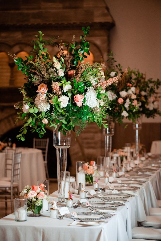 Elegantly decorated table florals in pink and peach at Union Station Nashville Yards in Nashville, Tennessee